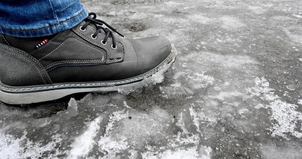 Casual winter footwear including boots and sneakers on snowy ground